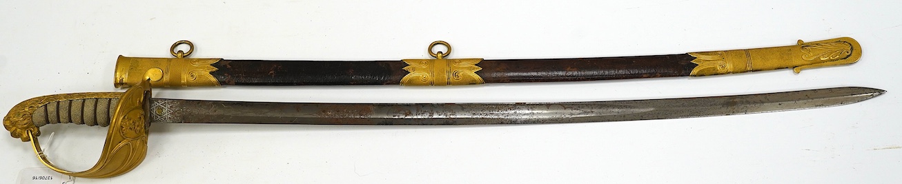 An East India Company naval officer's sword, blade by H. Wart, etched with East India Company device and foliage, regulation gilt, brass hilt with EIC device, white fish skin covered grip, in its leather scabbard with gi